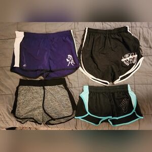 4 Pairs of Womens Athletic shorts, 2 medium, 2 small, pre-owned